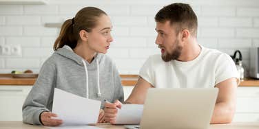 Young couple fighting about finances because wife is becoming the breadwinner 