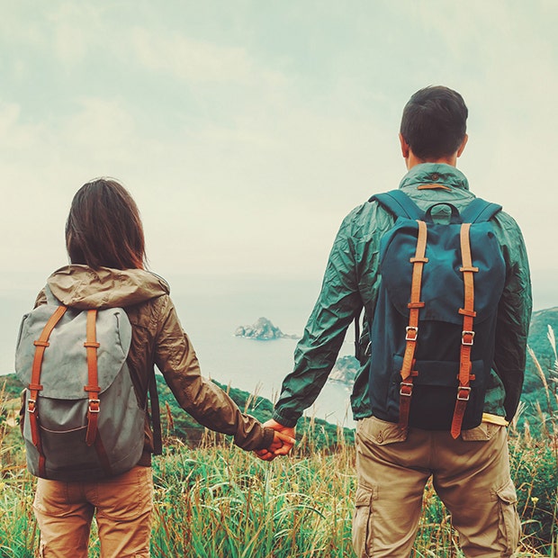 couple hiking and holding hands