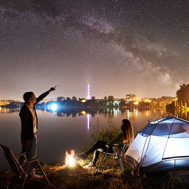 couple camping under the stars
