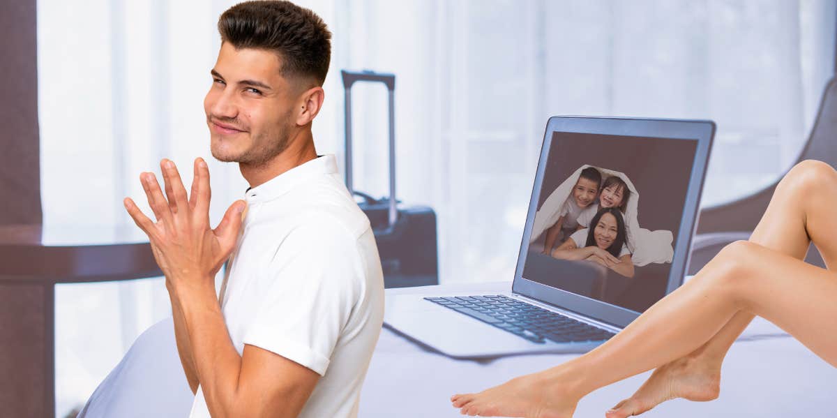 man looking mischevious on business trip with another woman in his bed and family photo on laptop