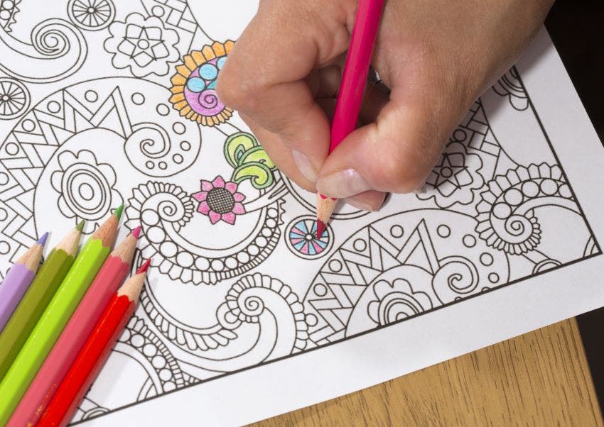 coloring book and colored pencils