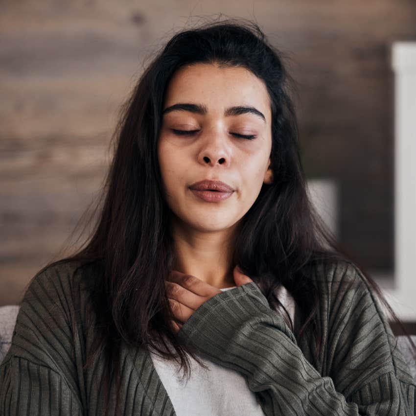 woman with anxiety trying to breathe