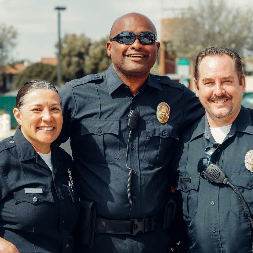 three smiling police officers