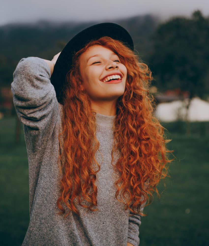 happy redheaded woman smiling