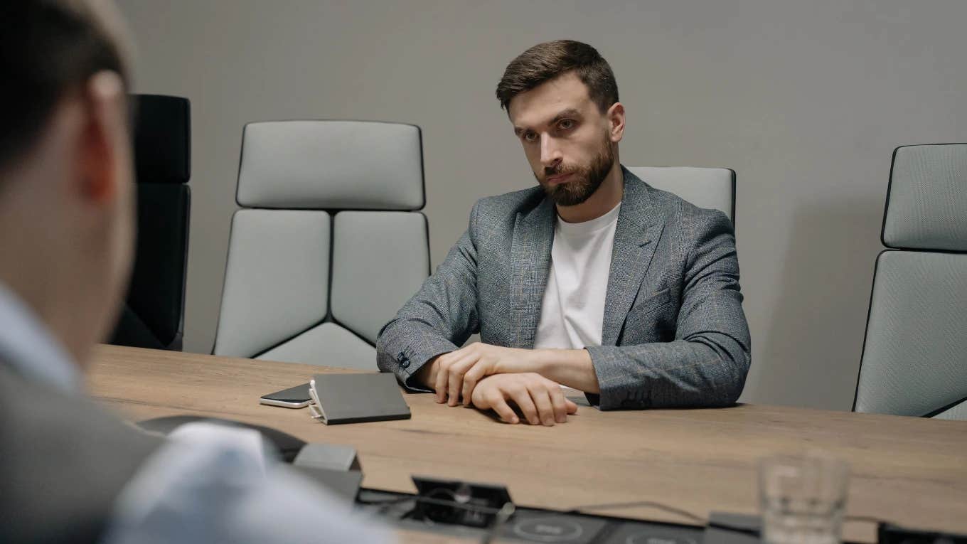 employee sitting at conference table