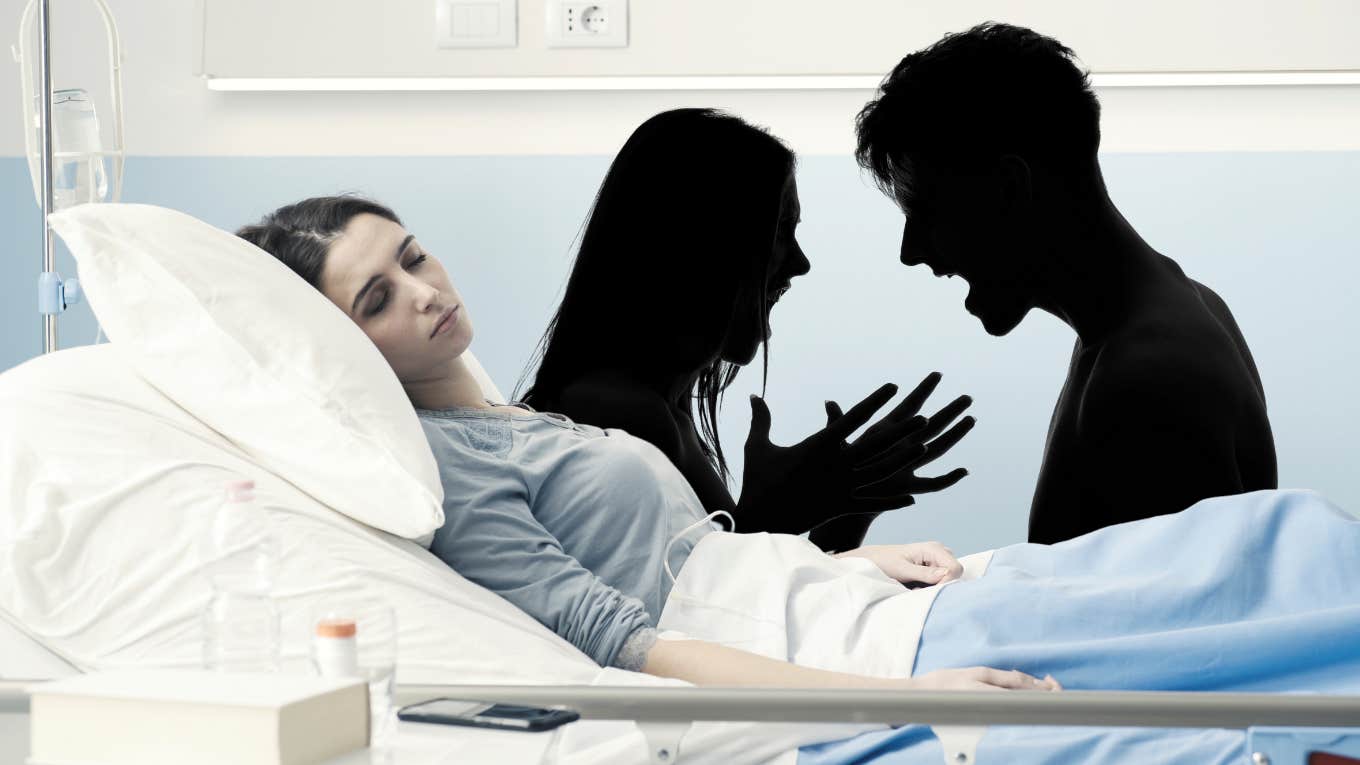 couple arguing behind woman in hospital bed