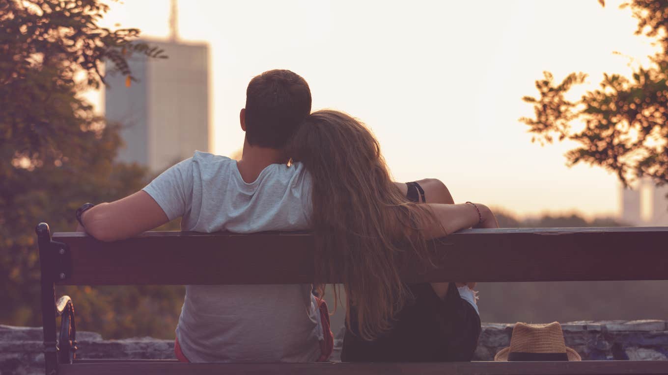 couple on bench enjoying sunset