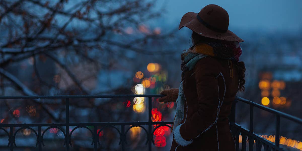 woman alone on dark evening in winter