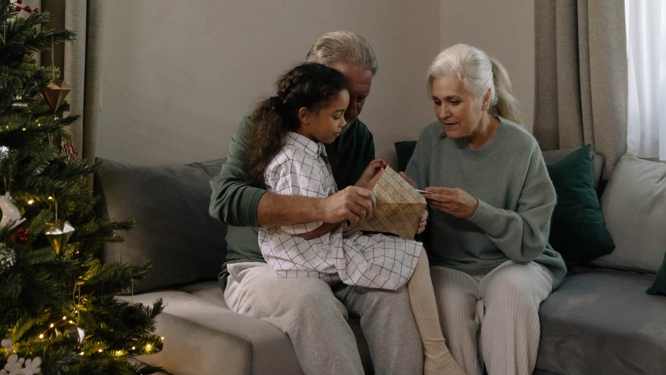 child and grandma opening gifts