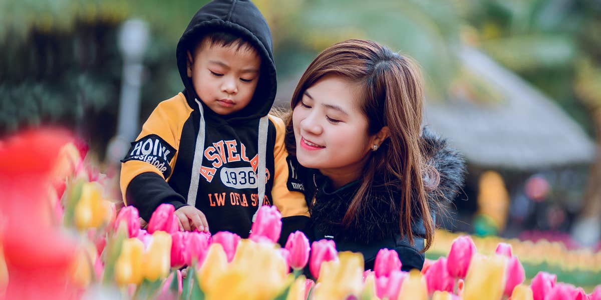 Mom and son in a flower garden