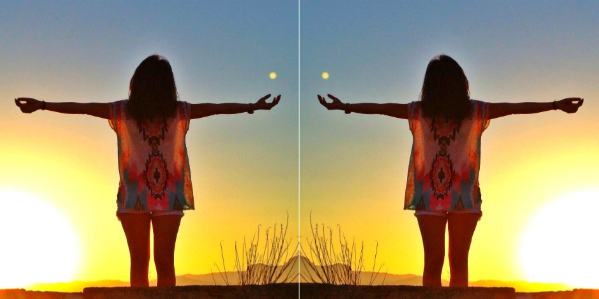 mirrored image of woman outside with moon