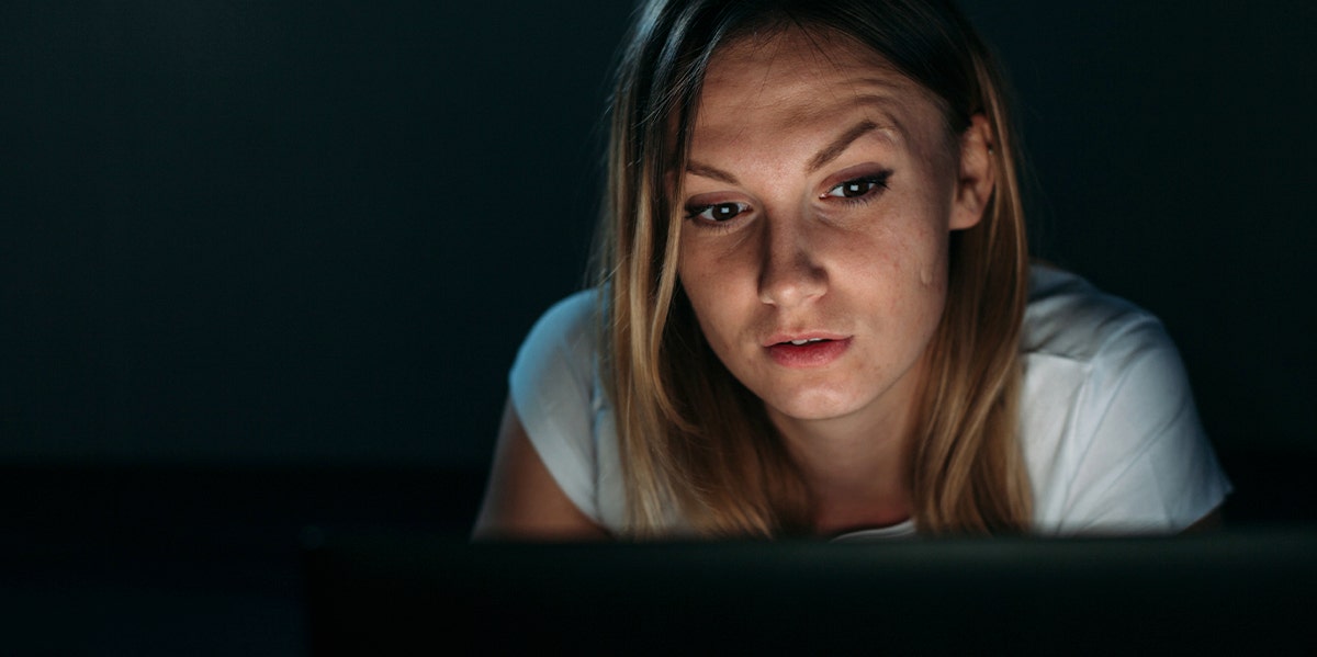 woman on laptop at night