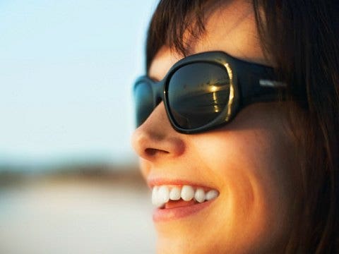 smiling woman wearing shades
