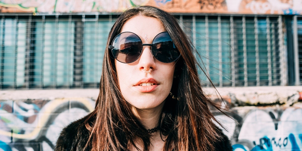 woman with septum piercing wearing sunglasses