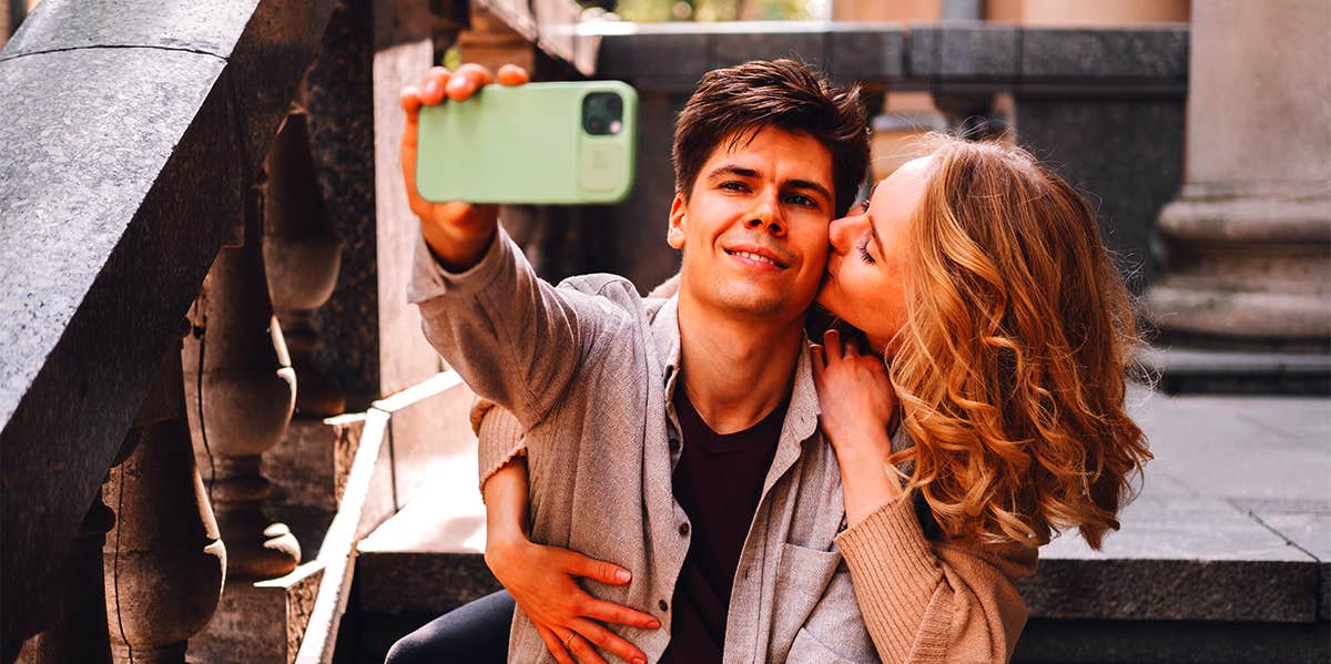 man taking selfie with woman