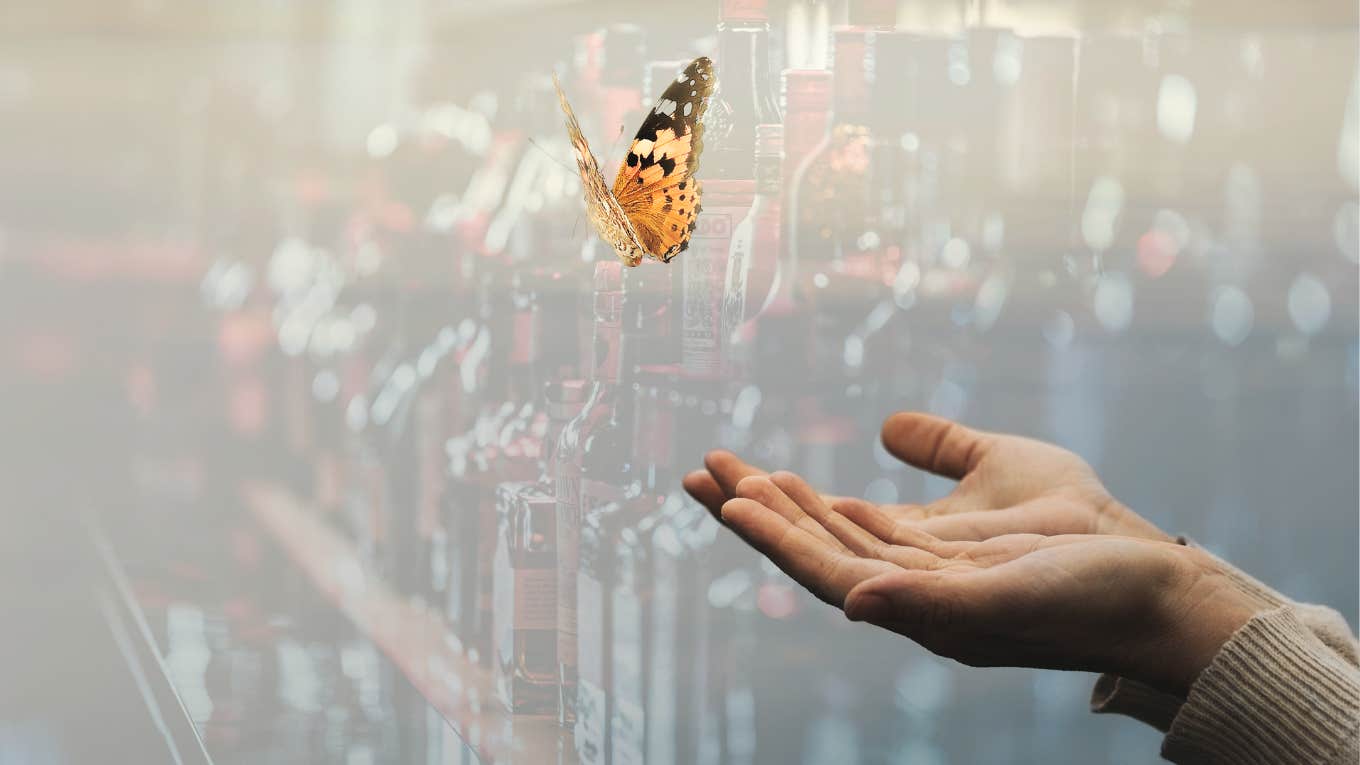 Woman letting go of butterfly, liquor behind her no longer controlling