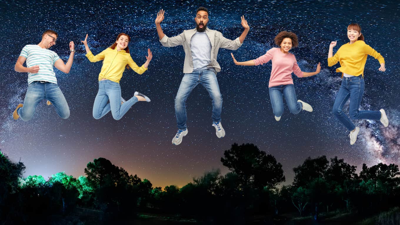 five people happily jumping