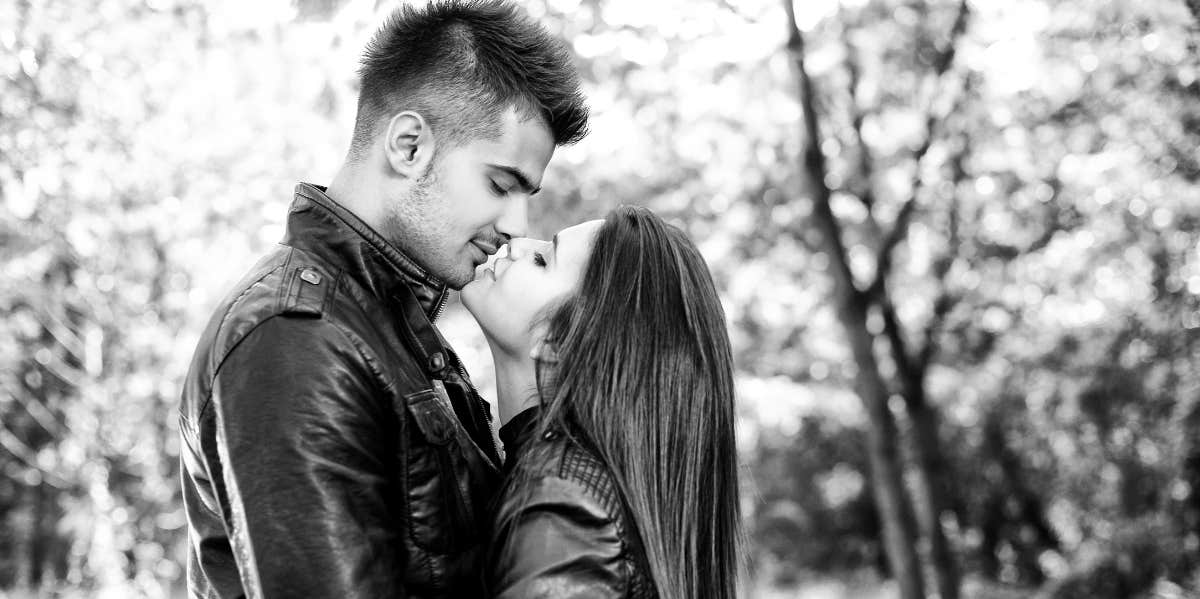 man and woman in romantic embrace black and white photo