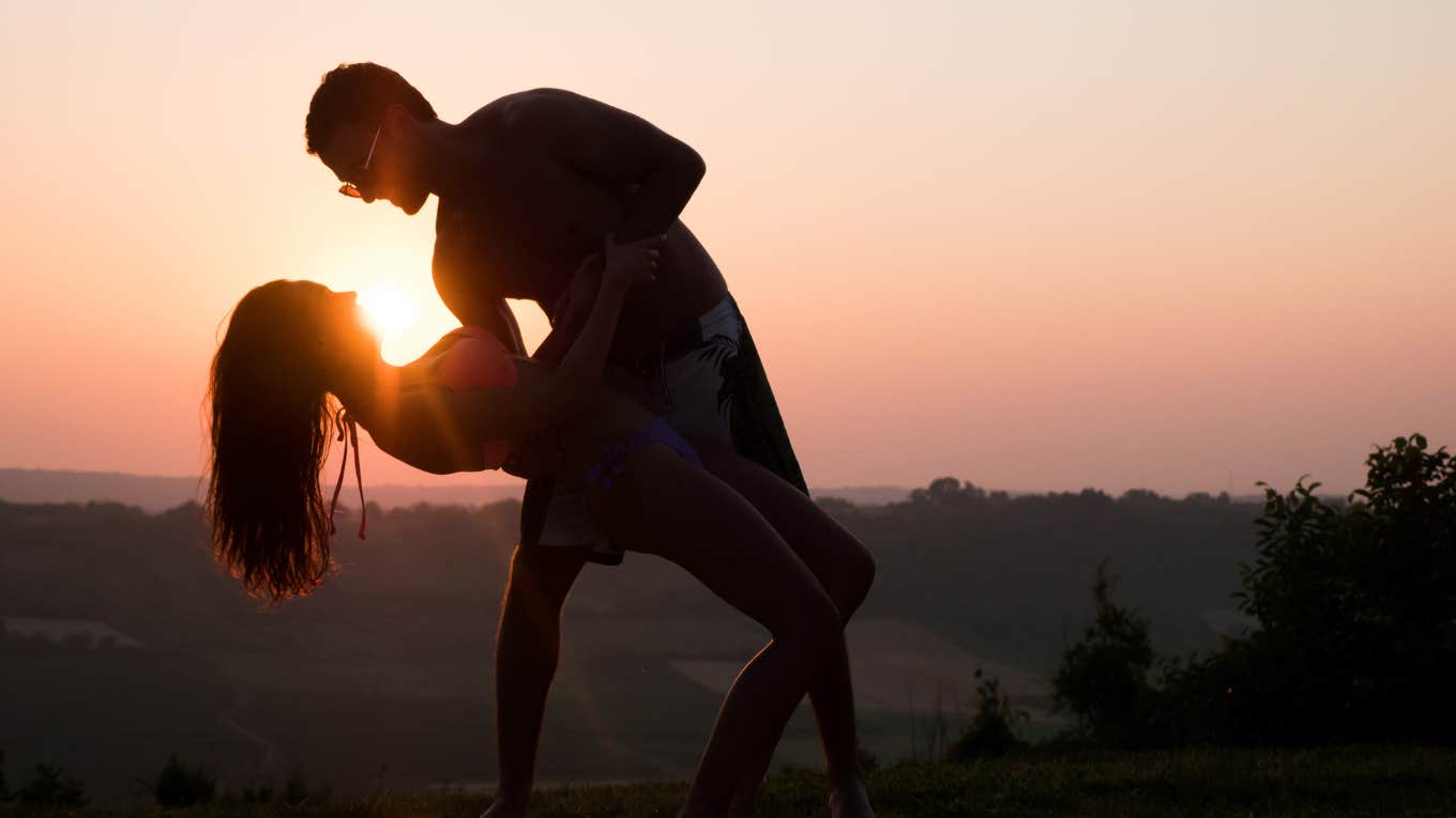 romantic dance at sunset by couple