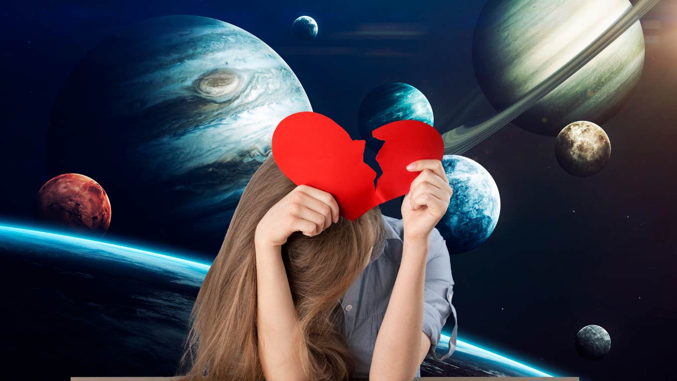 woman holding a broken heart