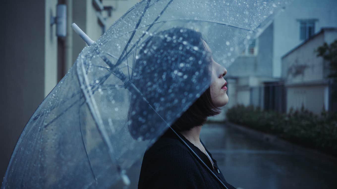 woman with umbrella in rain