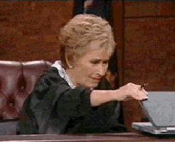 Judge Judith Sheindlin on Judge Judy opening and closing a laptop with disgust