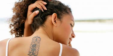 Woman with neck tattoo 