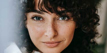 smiling woman with freckles