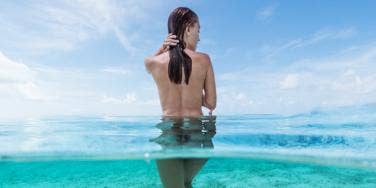 nude woman in ocean