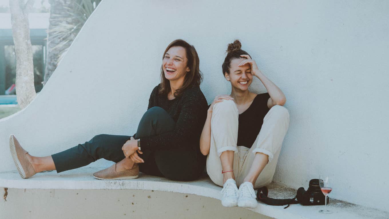 two women laughing 