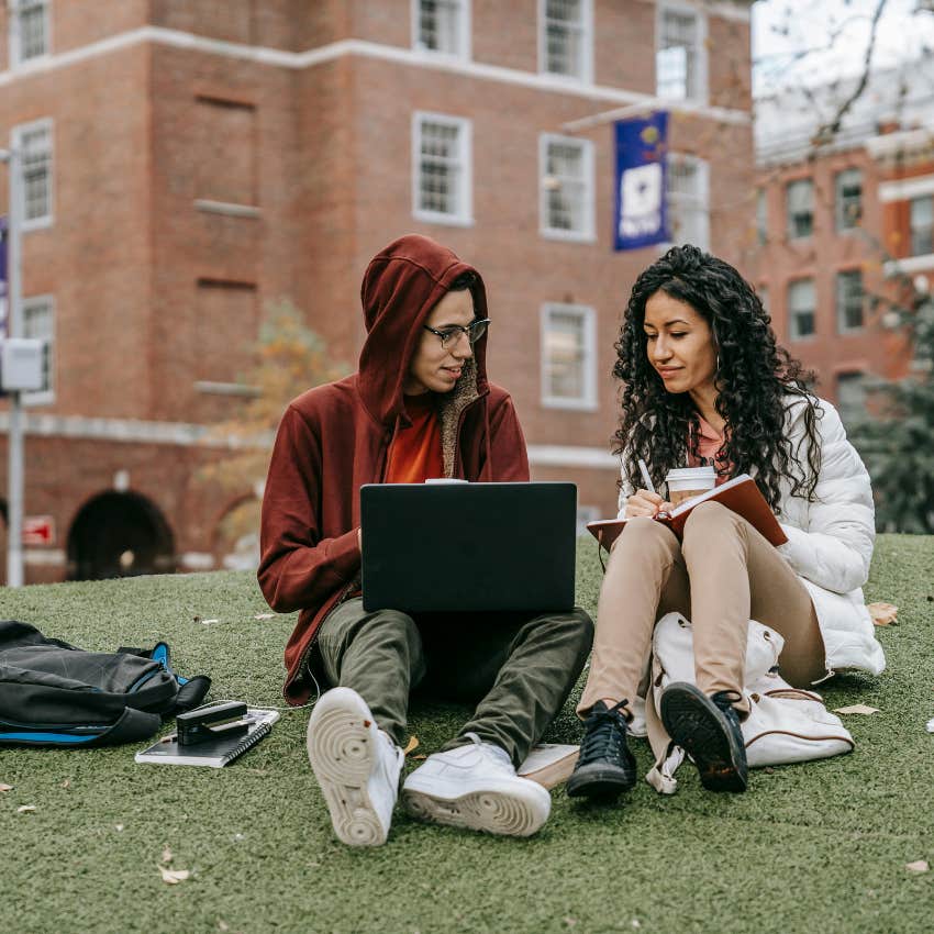 two students studying together 