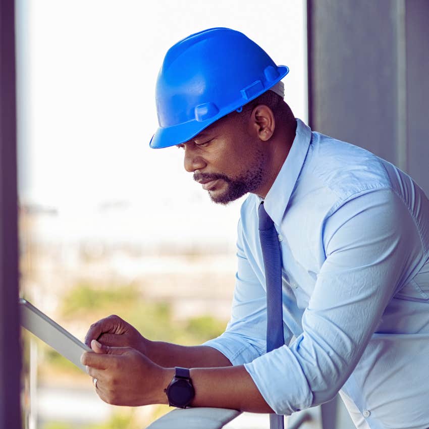 construction supervisor in a blue hard hat