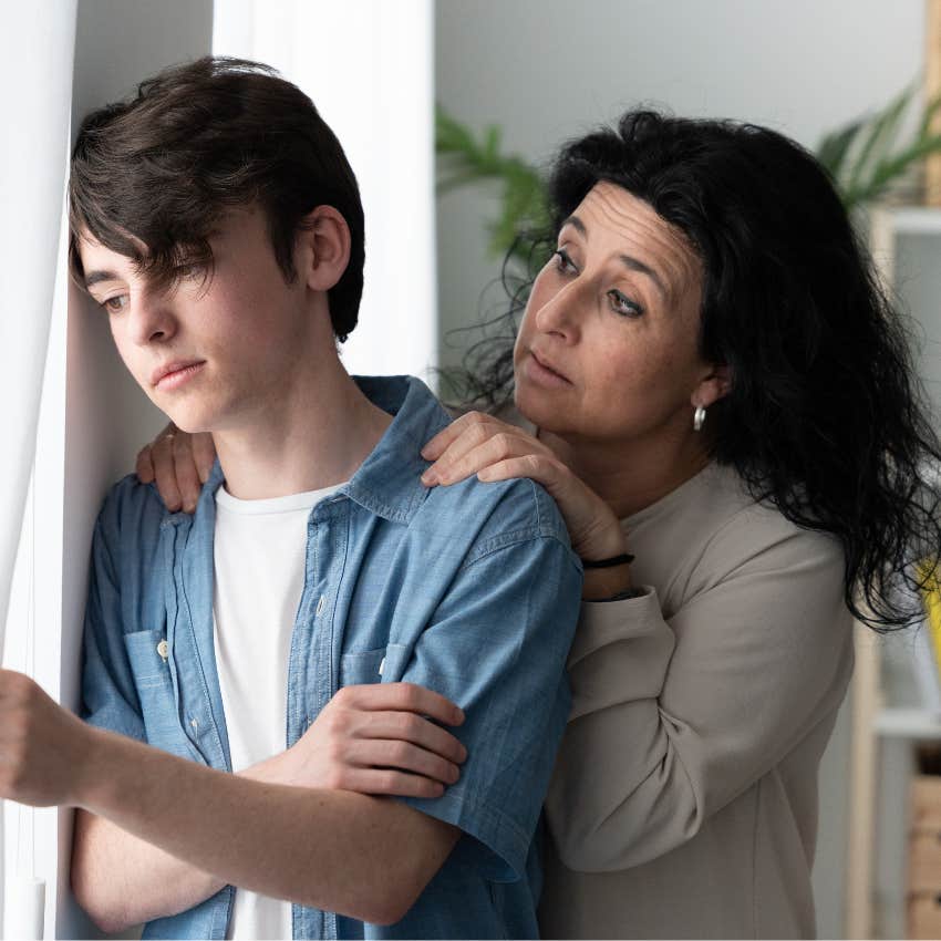 Mother consoling depressed teenage son. 