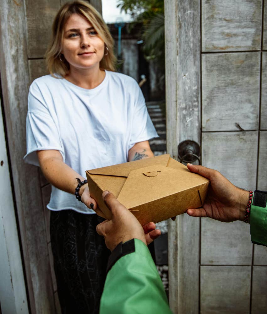 woman getting takeout delivered