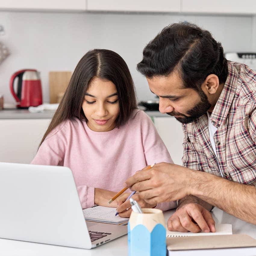 dad helping daughter with homework