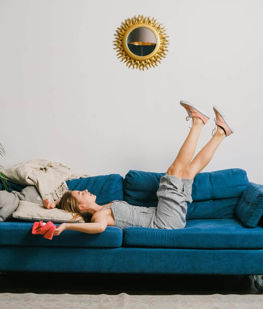 woman lying on couch 