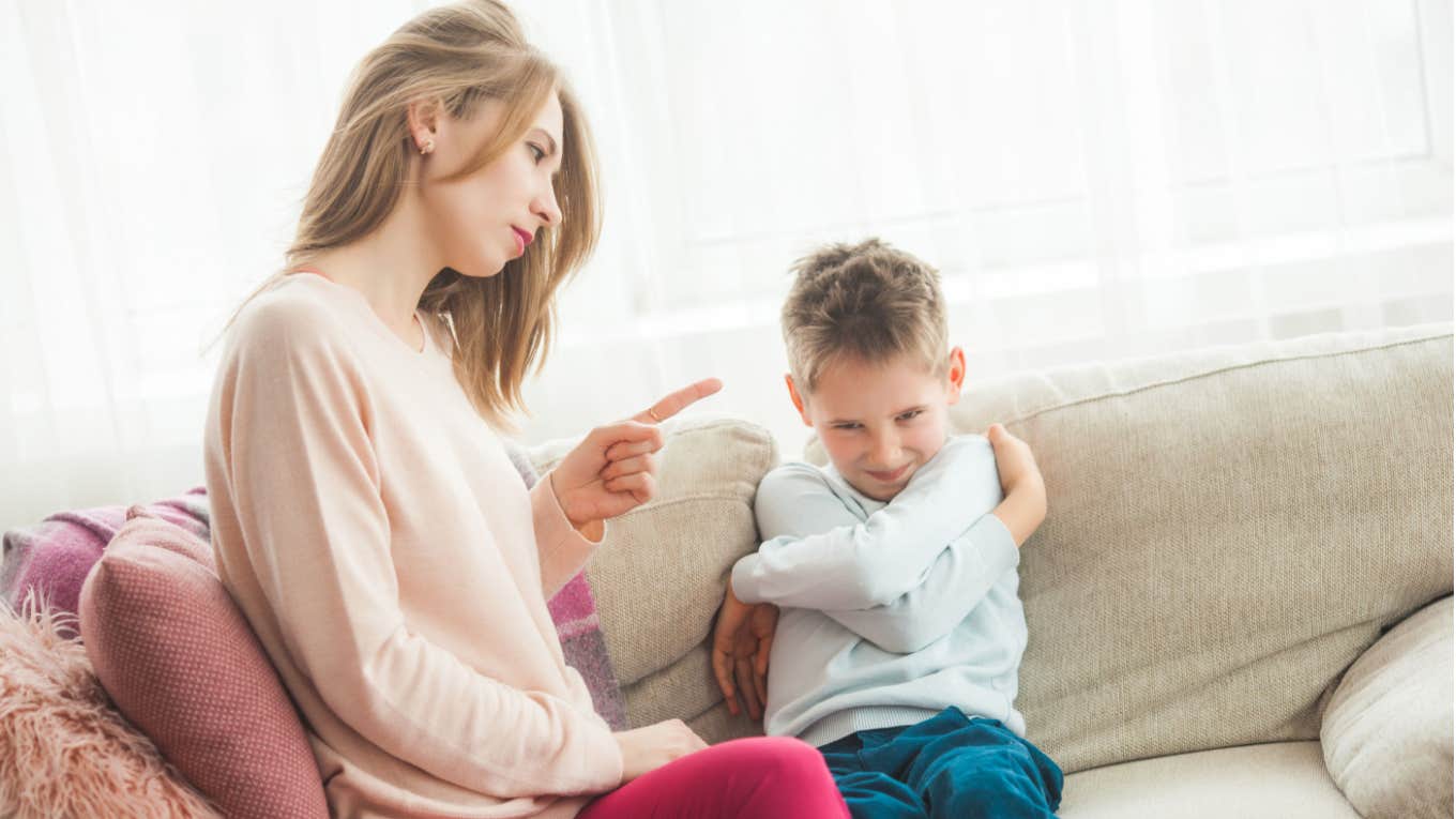 mom scolds mischievous son 