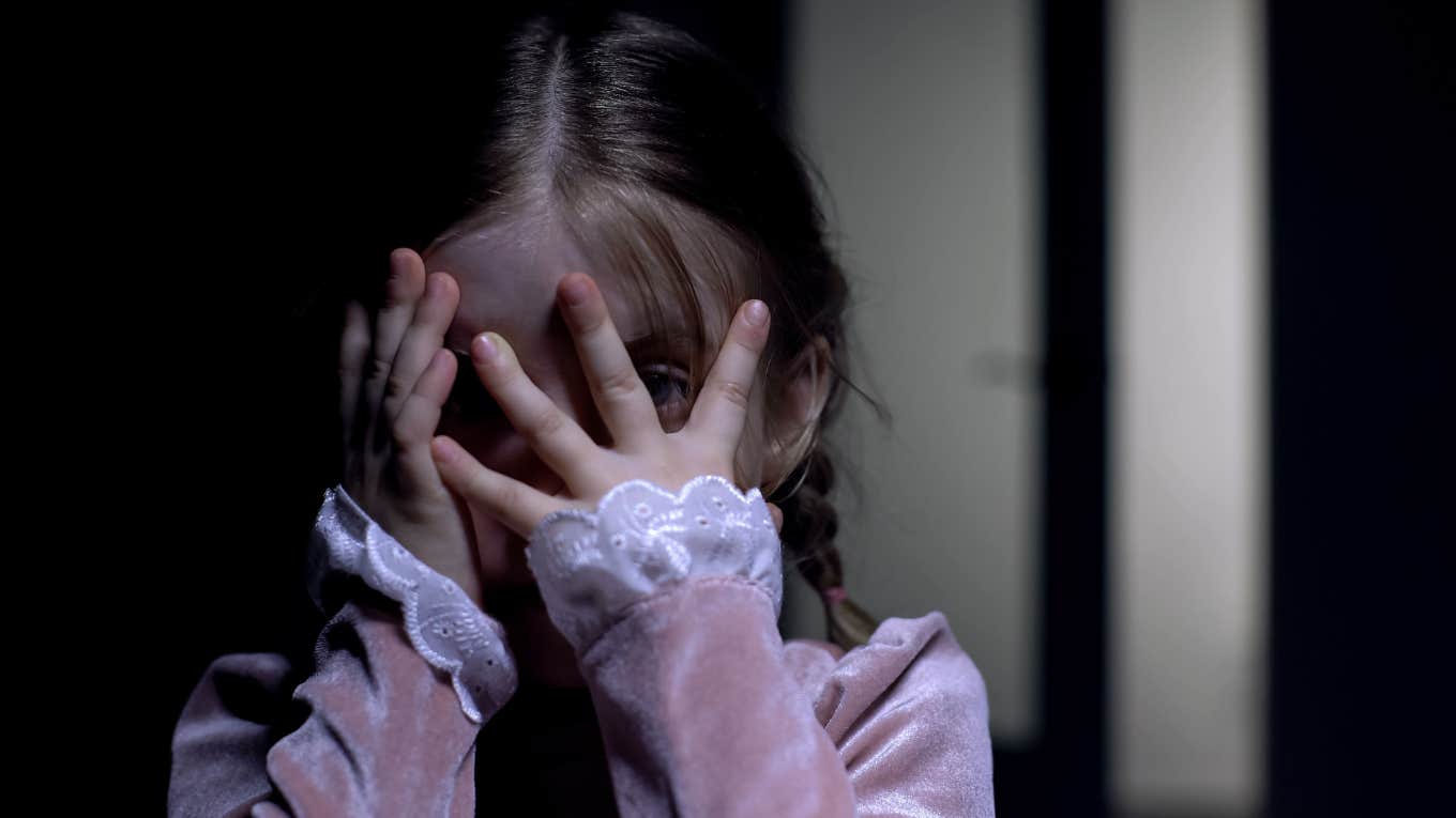 scared little girl sees a witch every night in her room