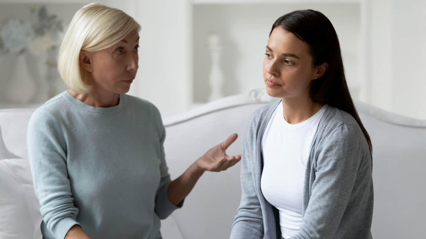 Mother and adult daughter in a stressful conversation.