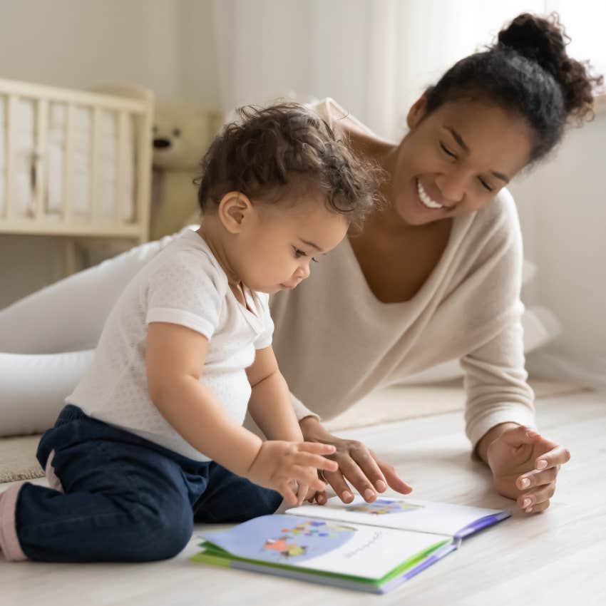 nanny reading to a baby
