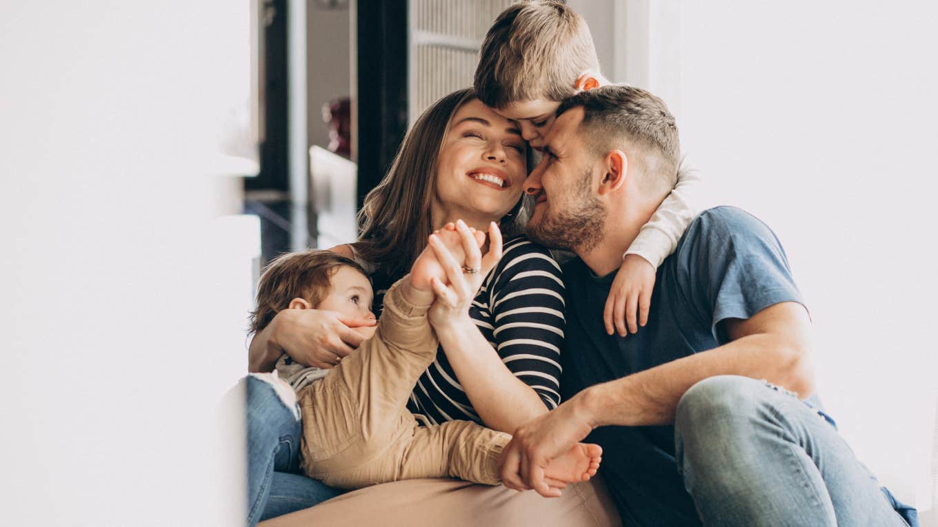 family laughing together and hugging