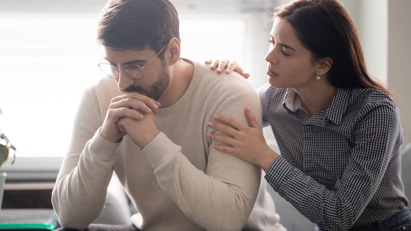 woman comforting man