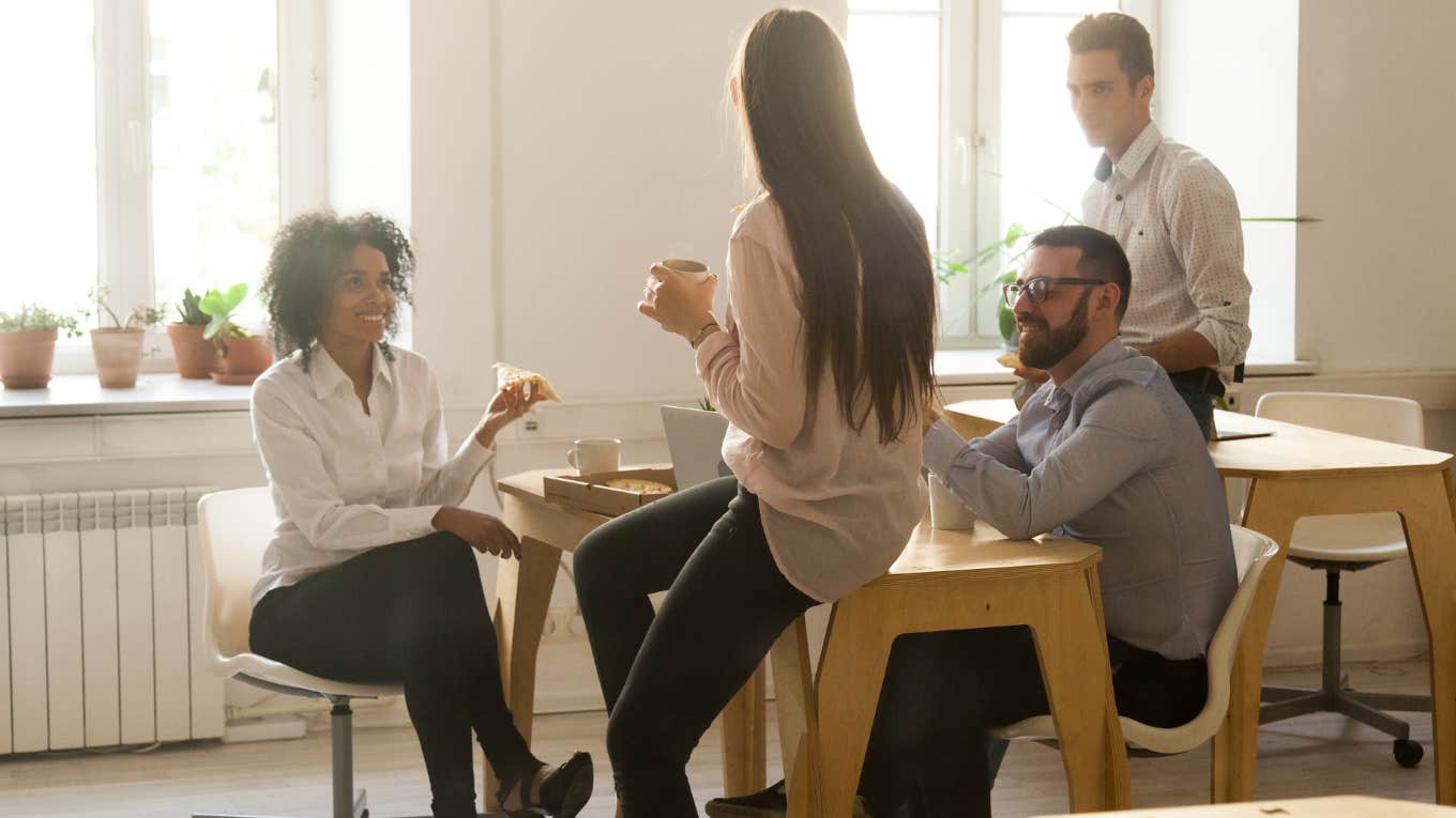 Break room filled with employees. 