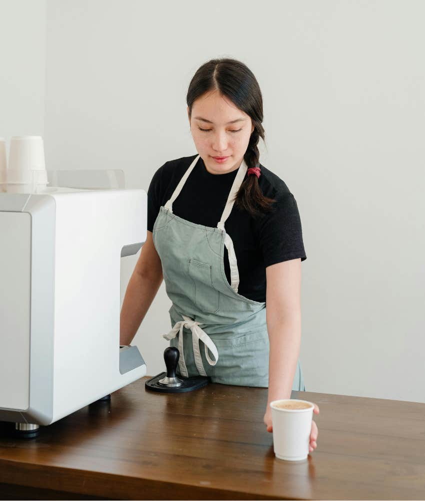barista pouring coffee