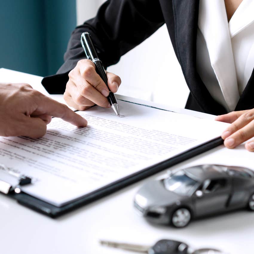 Man signing car rental contract. 