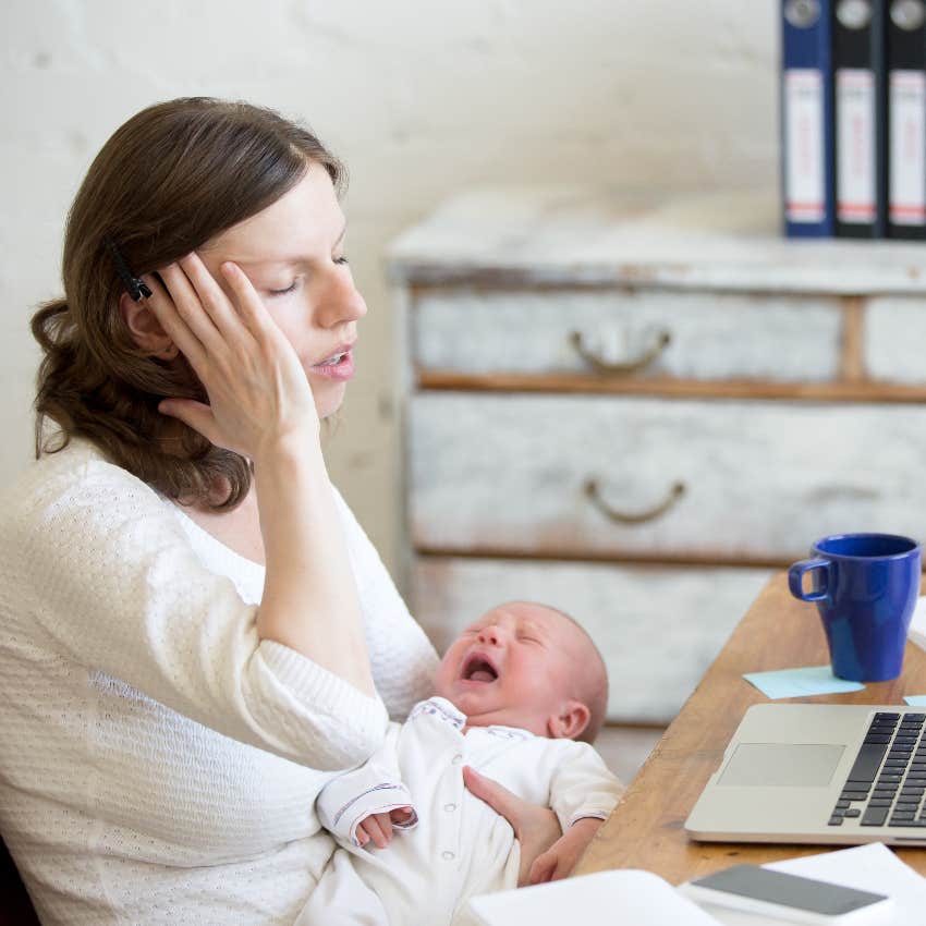 stressed new mom working on computer
