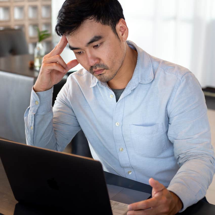 Stressed worker sitting in break room. 