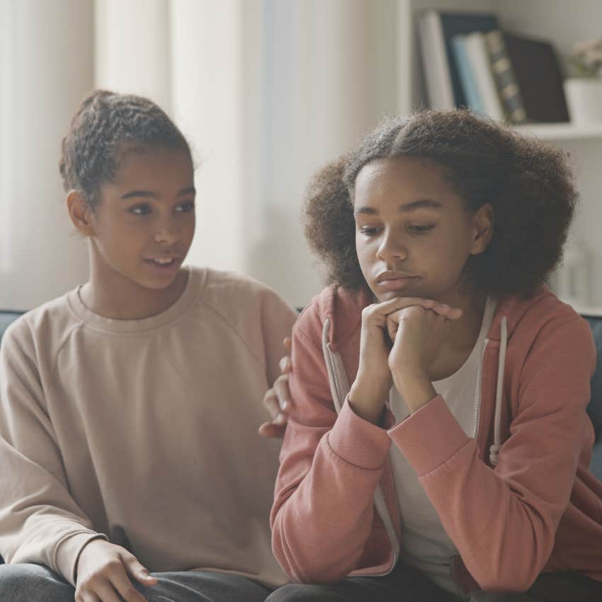 Teenage siblings looking stressed. 