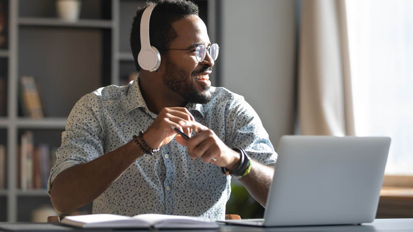 Man feeling happy at work without a bad boss. 