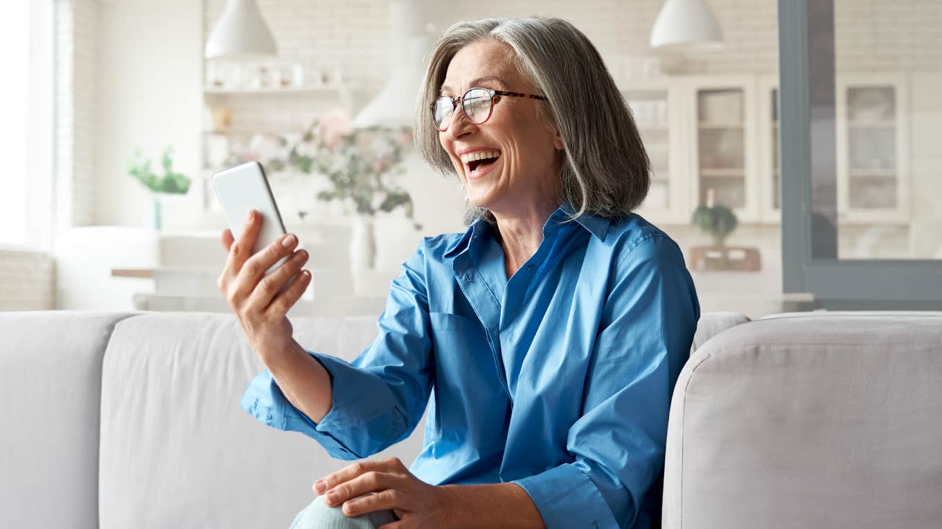 Therapist smiling while talking on the phone. 